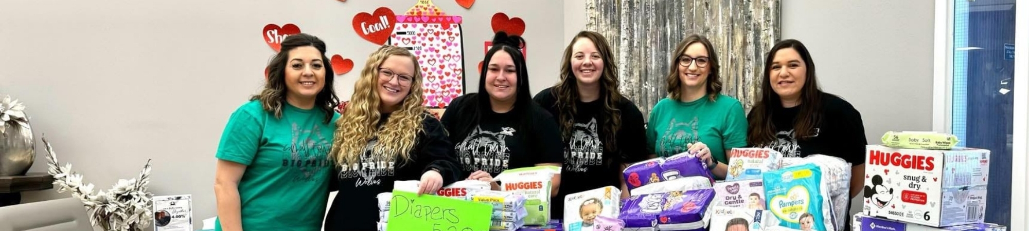 Employees of Trona Valley Federal Credit Union with diaper donations