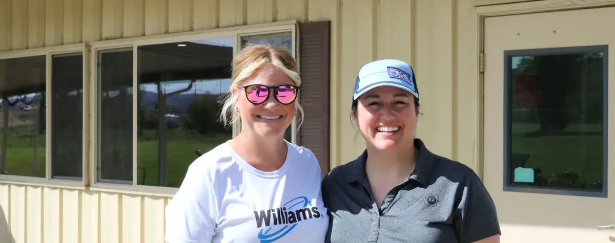 Williams employee and United Way employee at the golf tournament