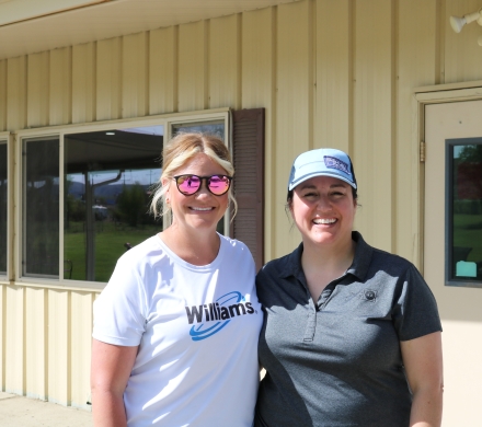 Williams employee and United Way employee at the golf tournament