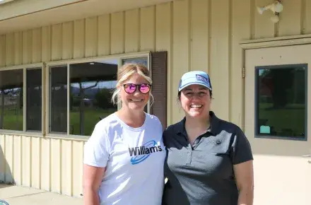 Williams employee and United Way employee at the golf tournament
